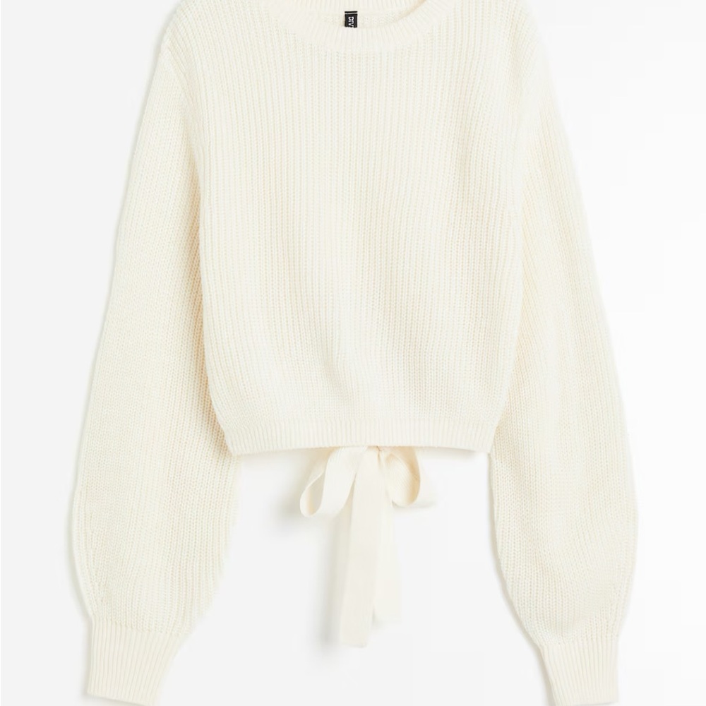 Cream sweater with open back bow